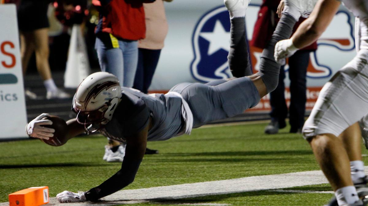 Central’s Davon Graham II (5) carries the ball down near the goal line, pushed out of bounds by Eaton’s Caden Gillespie (54). The Chargers scored shortly after the play, to tie the game at 7. The Eaton Eagles played the Central Chargers at Keller Stadium Friday, October 18, 2019.