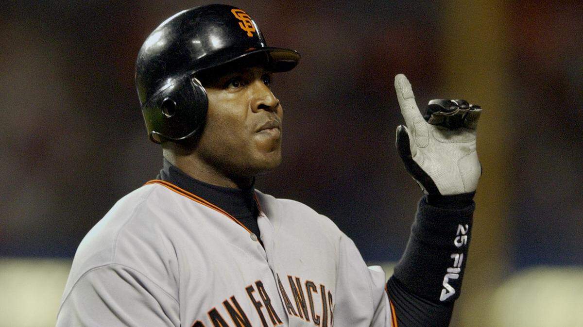 San Francisco Giants left fielder Barry Bonds reacts after flying out to Los Angeles Dodgers center fielder Dave Roberts during the fifth inning Monday, Sept. 16, 2002, at Dodger Stadium in Los Angeles. (AP Photo/Kevork Djansezian)