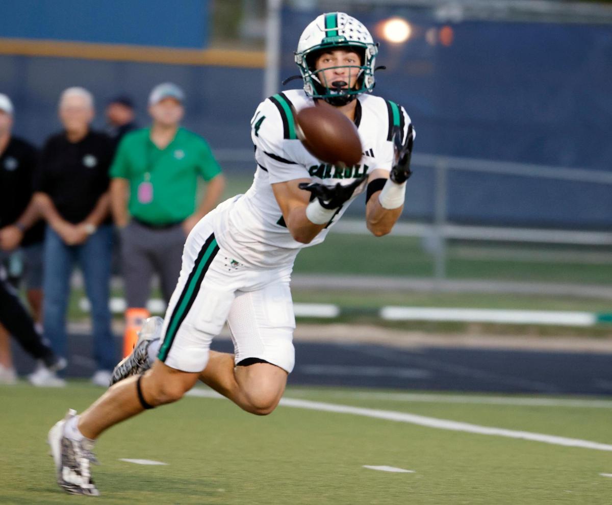 Carroll wide receiver Clayton Wayland (14) snags a long pass a yard short of the end zone in the first half of a UIL football game at Keller ISD Stadium in Keller, Texas, Thursday, Oct. 05, 2023.