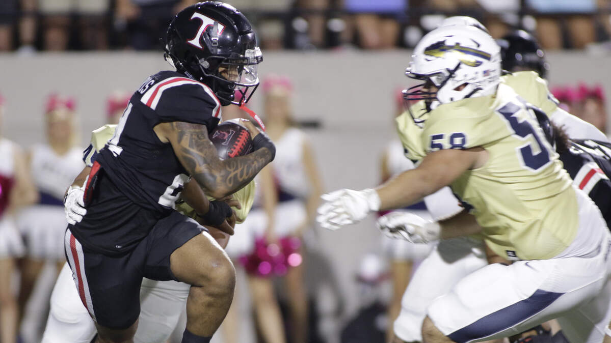 Euless Trinity running back JT Harris carries the ball against Keller during their game on Friday, October 17, 2025 at Pennington Field in Bedford, Texas.