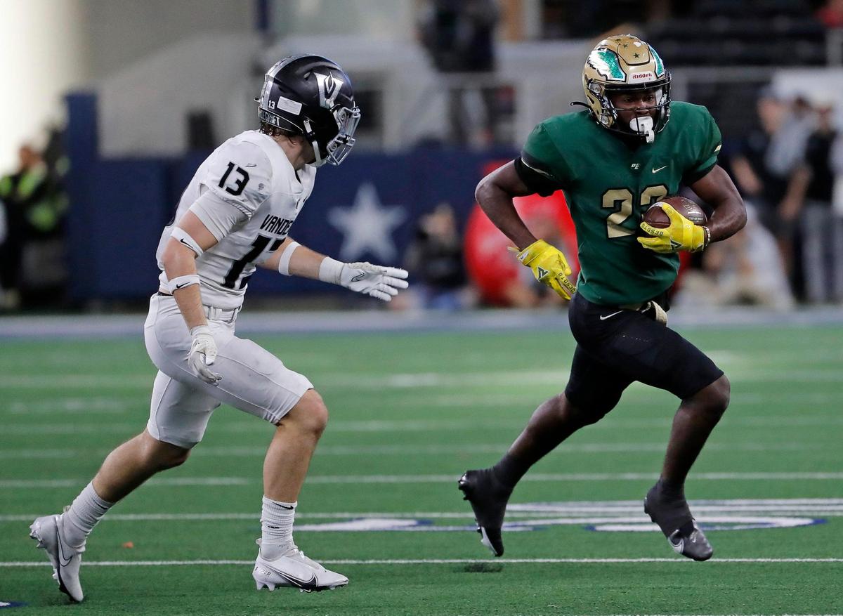 DeSoto ball carrier Deondra Riden out runs Austin Vandegrift defensive back Davis Scott in the first half of a UIL Class 6A D2 state championship football game at AT&T Stadium in Arlington, Texas, Saturday, Dec. 16, 2022. DeSoto defeated Vandegrift 42-17. (Star-Telegram Bob Booth)