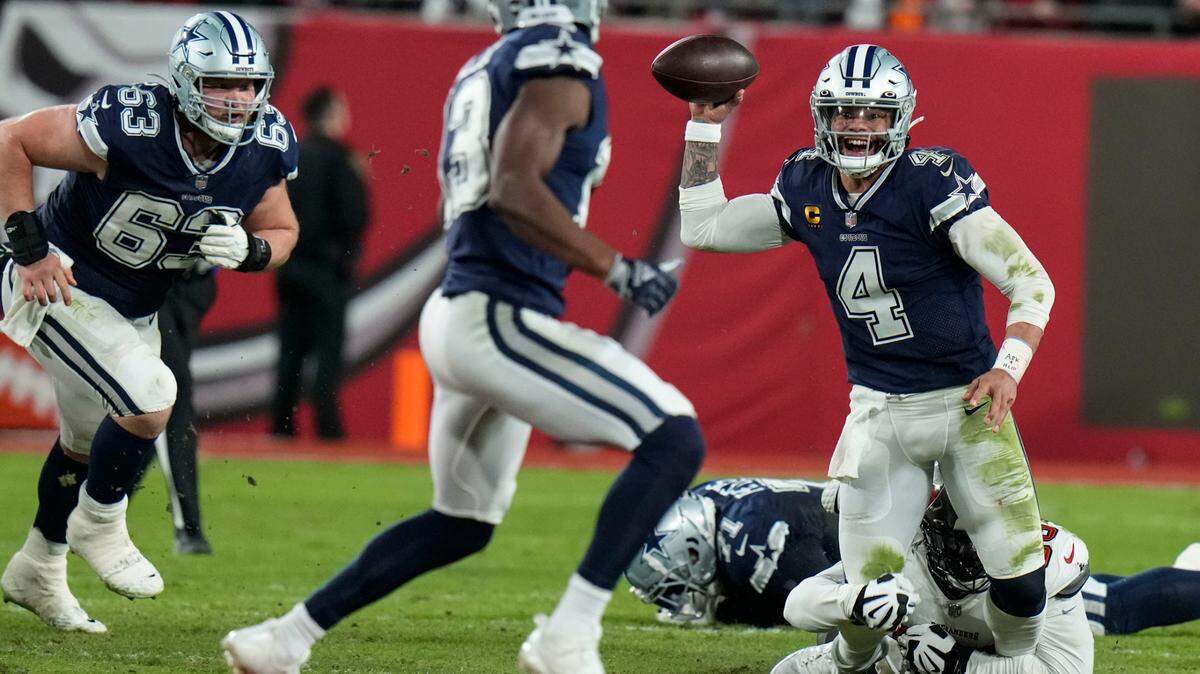 Dallas Cowboys quarterback Dak Prescott (4) gets off a pass as he is brought down by Tampa Bay Buccaneers defensive tackle Rakeem Nunez-Roches during the first half of an NFL wild-card football game, Monday, in Tampa, Fla.
