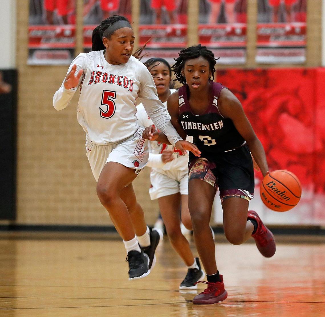 Timberview guard Stephanie Mosley (0) drives the ball down court against Legacy guard Savannah Catalon (5) in the second half of a 8-5A district high school girls basketball game at Legacy High School in Mansfield, Texas, Friday, Jan. 22, 2021. Legacy defeated Timberview 46-21. (Special to the Star-Telegram Bob Booth)