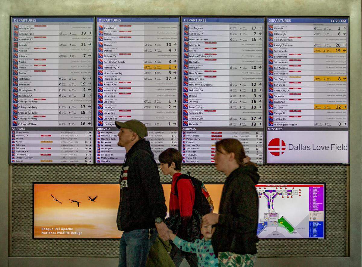The status board inside the concourse at Dallas Love Field Airport on Wednesday still showed quite a few flights canceled.