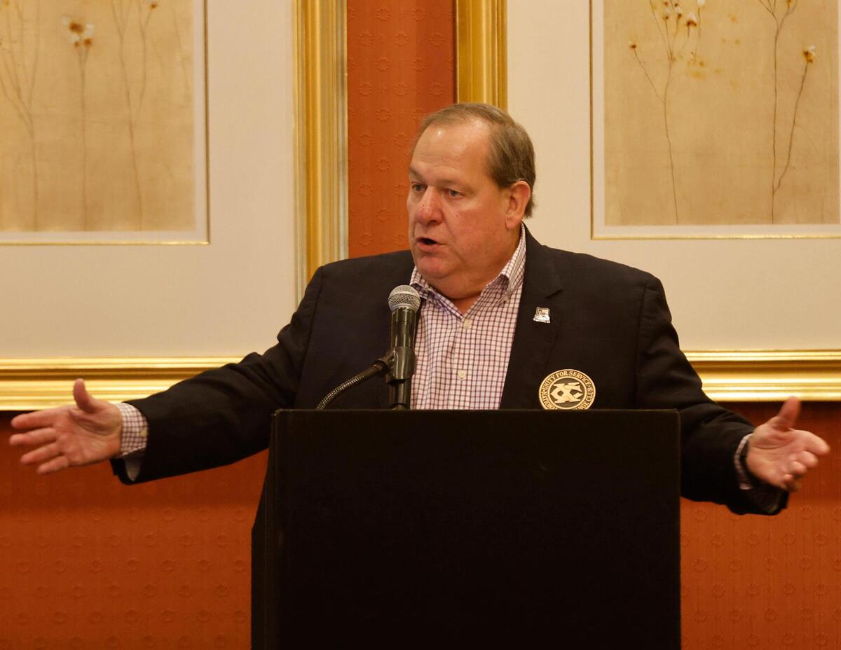 Keynote speaker Lance Barrow, an Emmy-winning CBS Sports producer, gestures during his keynote speech at the Exchange Club’s annual Christmas fundraiser at the Fort Worth Club in Fort Worth, Texas, Wednesday, Dec. 4, 2024.