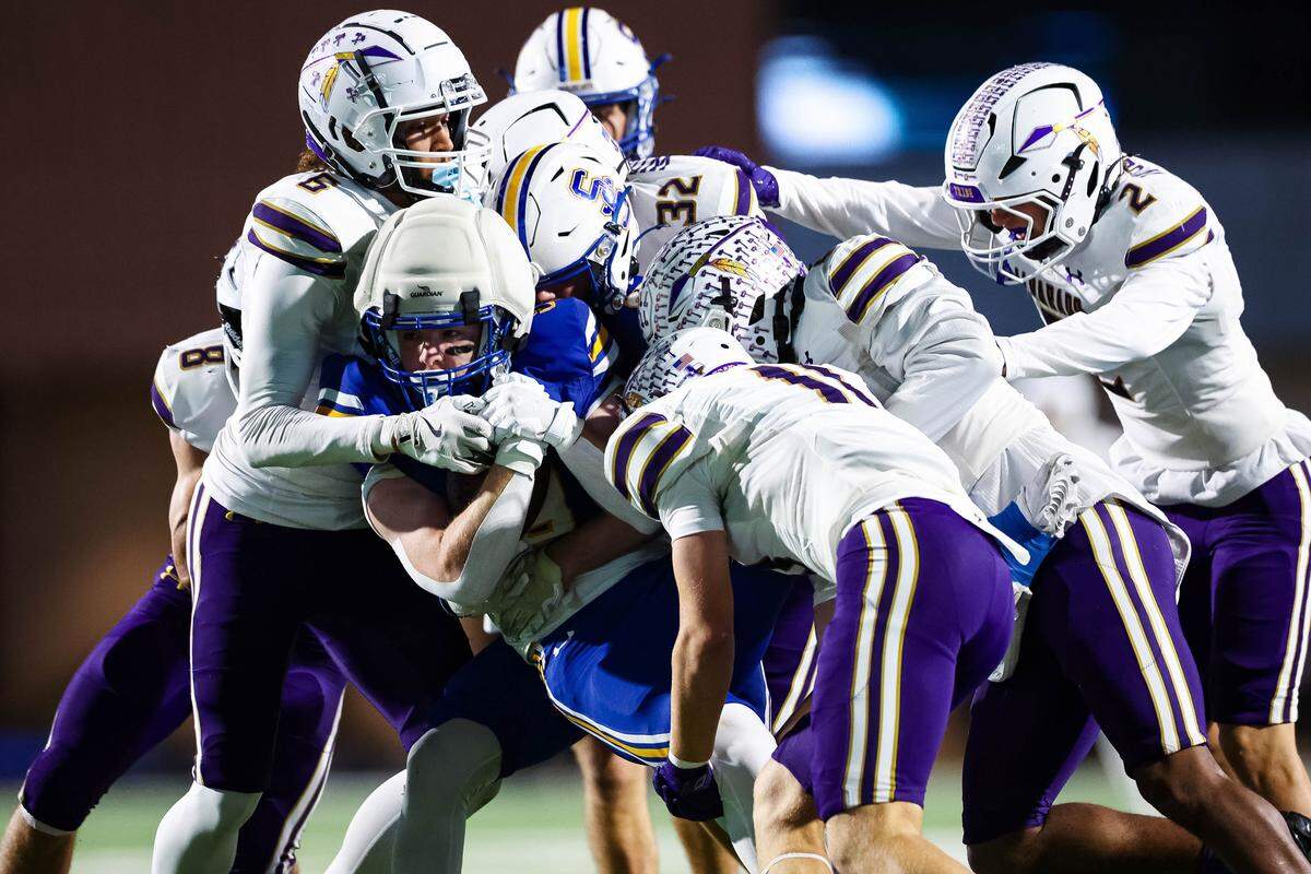 Alvarado defensive players swarm a Sulphur Springs running back in a Class 4A Division I area playoff game Friday.