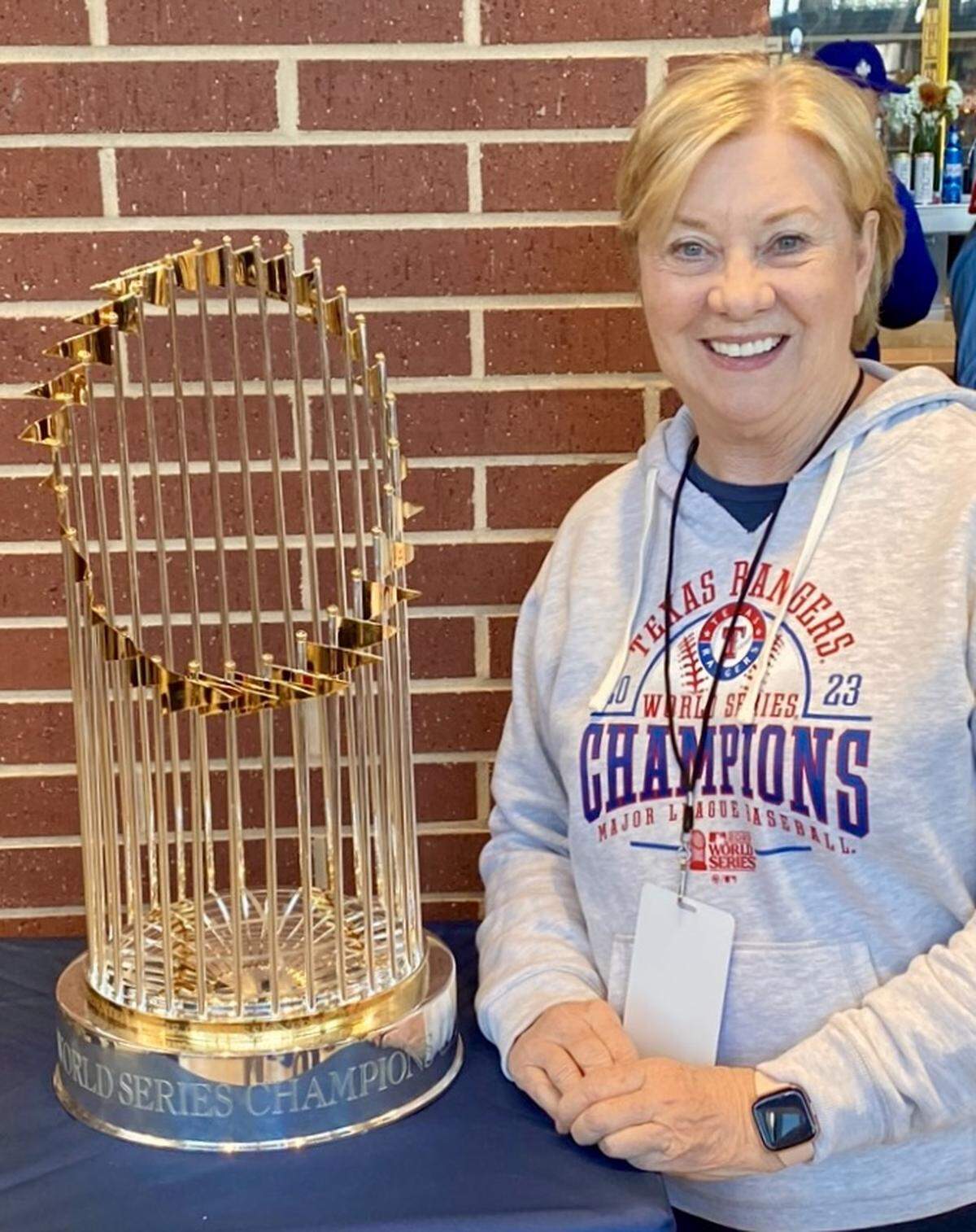 Arlington city Councilwoman Helen Moise with the Texas Rangers’ World Series trophy.