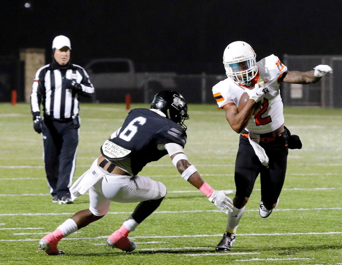 Timberview outside linebacker Adam Cash (6) goes after Lancaster running back Tre Bradford (2) during a high school football game at R. L. Anderson Stadium in Mansfield, Texas, Friday, Oct. 25, 2019. Lancaster led by 7 at the half. (Special to the Star-Telegram Bob Booth)