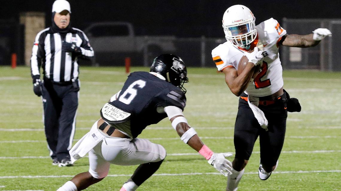Timberview outside linebacker Adam Cash (6) goes after Lancaster running back Tre Bradford (2) during a high school football game at R. L. Anderson Stadium in Mansfield, Texas, Friday, Oct. 25, 2019. Lancaster led by 7 at the half. (Special to the Star-Telegram Bob Booth)