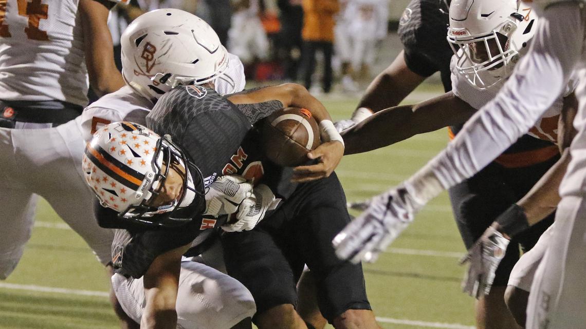 Haltom quarterback Michael Black (12) goes in for a 2-point conversion in last Friday’s bi-district playoff victory over Arlington Bowie. Haltom takes on Midland Lee at 3 p.m. Saturday at Abilene Christian University in the Class 6A Division II area playoffs.