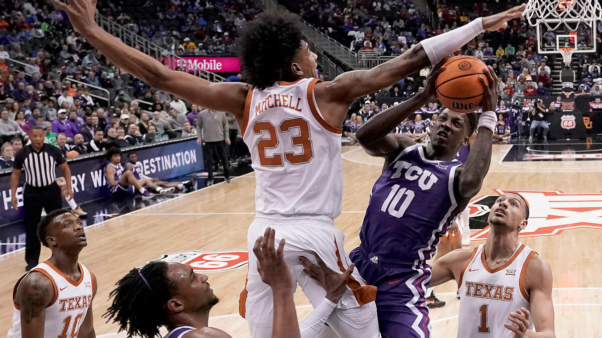 TCU guard Damion Baugh (10) shoots under pressure from Texas forward Dillon Mitchell (23) during their Big 12 tournament semifinal on Friday in Kansas City.
