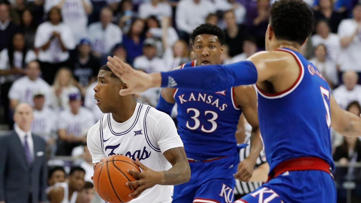 TCU guard Kendric Davis (5) is defended by Kansas guard Quentin Grimes (5) and forward David McCormack (33) in the first half of a NCAA college basketball game at Schollmaier Arena in Fort Worth, Texas, Monday, Feb. 11, 2019. The score was knotted 37 at the half. (Star-Telegram Bob Booth)