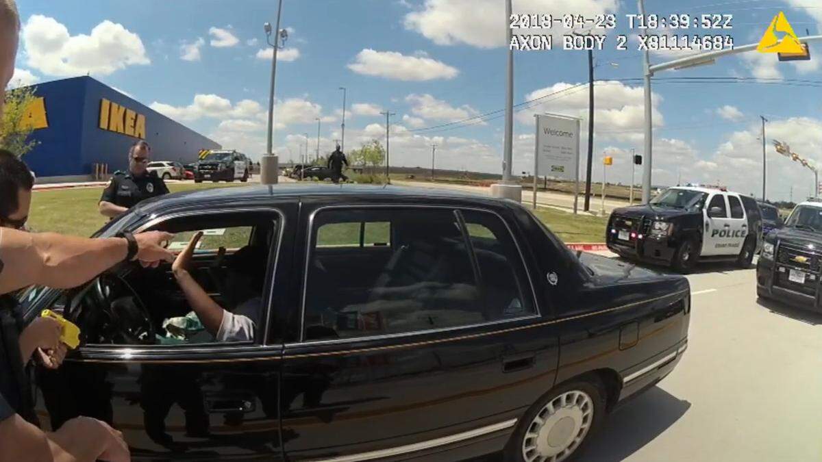 When Carlos High was told to put his hands in the air because he had a rifle in his lap, he did. But when a Grand Prairie police officer rushed the situation by leaning into High’s driver side window, High got spooked and lowered one of his hands. When the officers stepped back, pulled out their guns and began yelling at him, High grabbed the rifle and was shot several times, according to body camera footage.