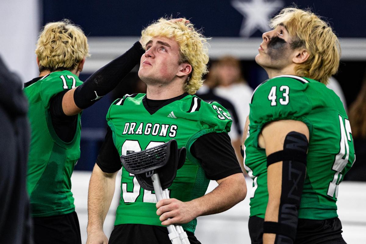 Southlake linebacker Williams Leans (32) and defensive lineman Crawford Taylor (43) react emotionally after losing the UIL 6A Division II championship game against Austin Vandergrift at AT&T Stadium in Arlington on Saturday, Dec. 21, 2024.