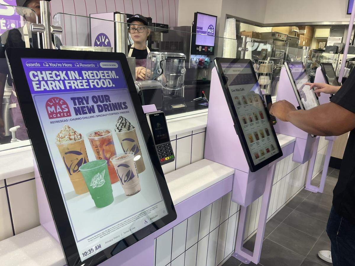 Customers order from the new Live Mas Cafe menu at Taco Bell in Dallas, 5506 E. Mockingbird Lane on Thursday, Nov. 6, 2025. The new menu features over 20 beverages.