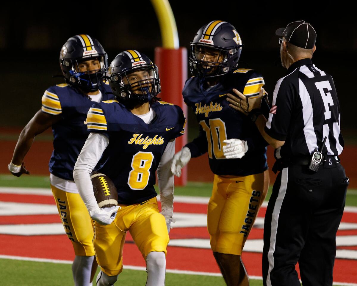 Arlington Heights defensive back Muhammad Nixon (8) comes out of the pile with a punt turnover during a District 4-5A D1 football game at Farrington Field in Fort Worth, Texas, Thursday, Oct. 10, 2024. (Special to the Star-Telegram / Bob Booth)
