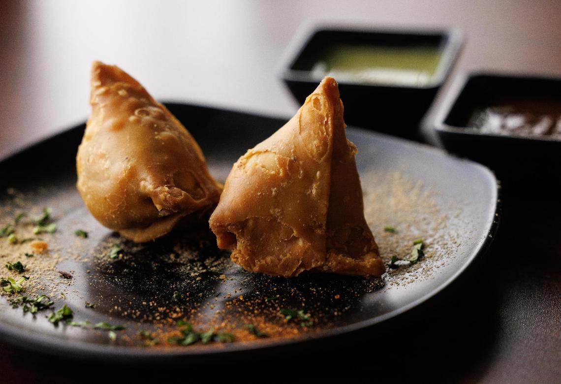 Vegetarian samosas with tamarin sauce and mint chutney on Thursday, April 3, 2025, in Saginaw.