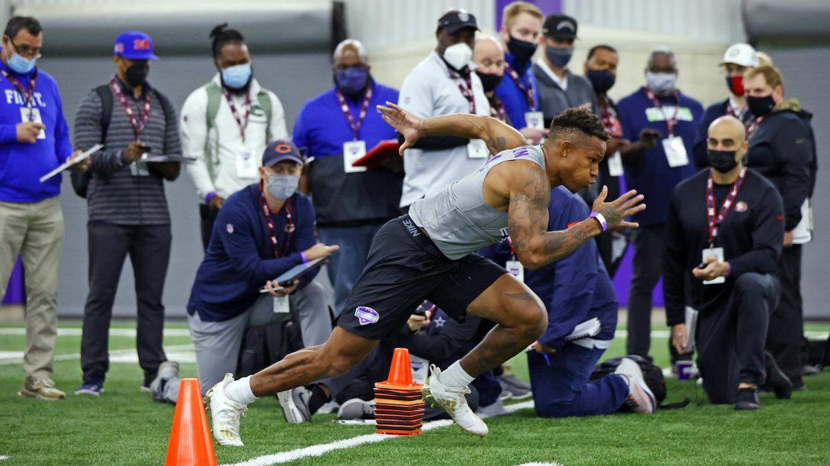 TCU safety Ar’Darius Washington runs the 40-yard dash during the school’s 2021 pro day.