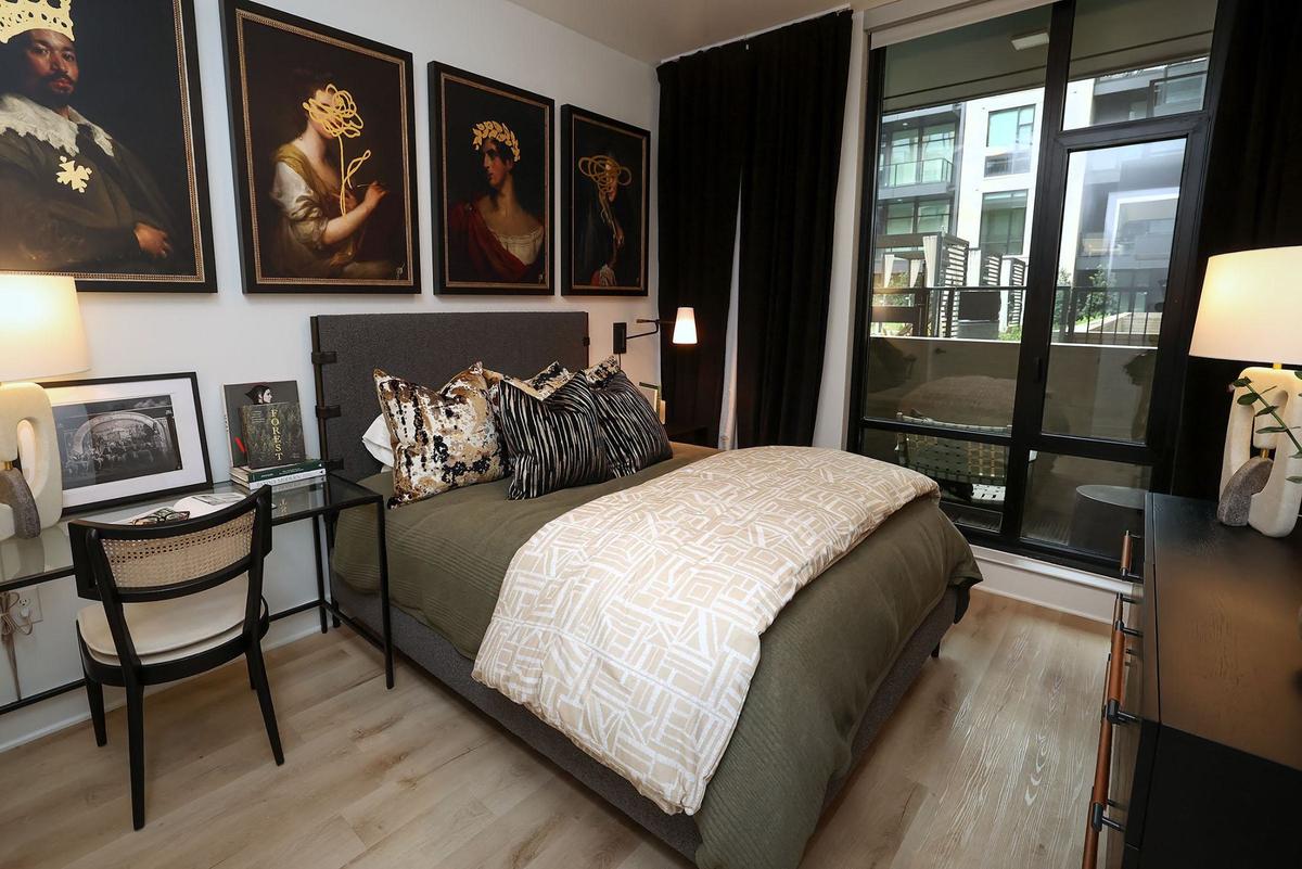 A bedroom of a Crescent Residences model unit on Wednesday, Sept. 4, 2024. There are 168 units in the luxury apartment complex that is part of the Cultural District’s Crescent development.