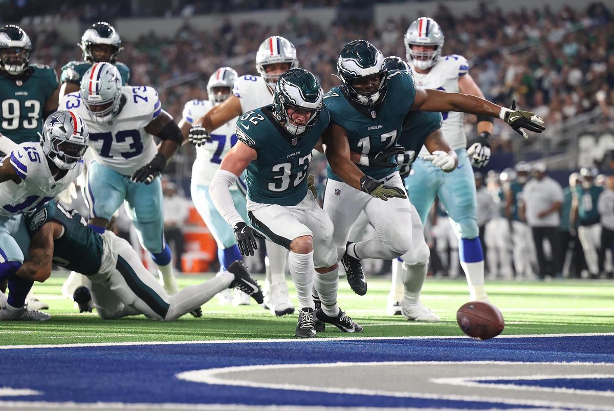 Philadelphia Eagles safety Reed Blankenship (32) and linebacker Nakobe Dean (17) rush towards a loose ball after Dallas Cowboys running back Ezekiel Elliott fumbled near the end zone on Sunday, Nov. 10, 2024, at AT&T Stadium.