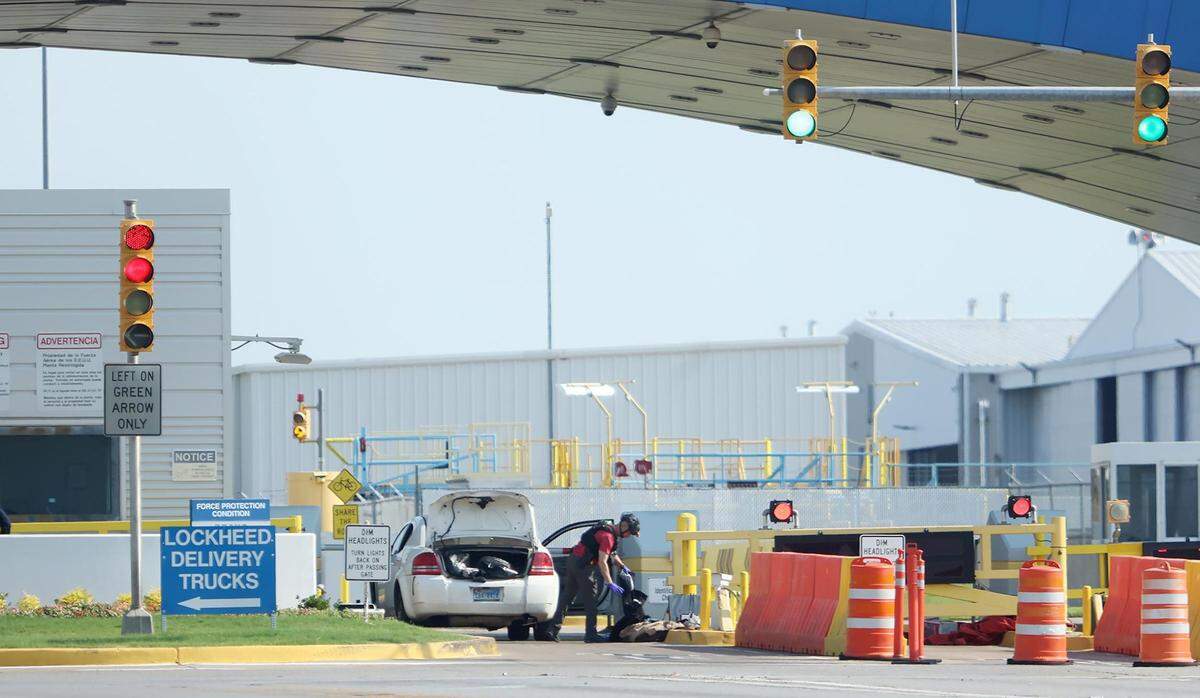 Fort Worth Police Department bomb technicians search a vehicle outside the gate to Lockheed Martin on Thursday, May 19, 2022. A man fatally shot himself outside the gate according to White Settlement Police Chief Chris Cook. No explosive devices were found in the vehicle.