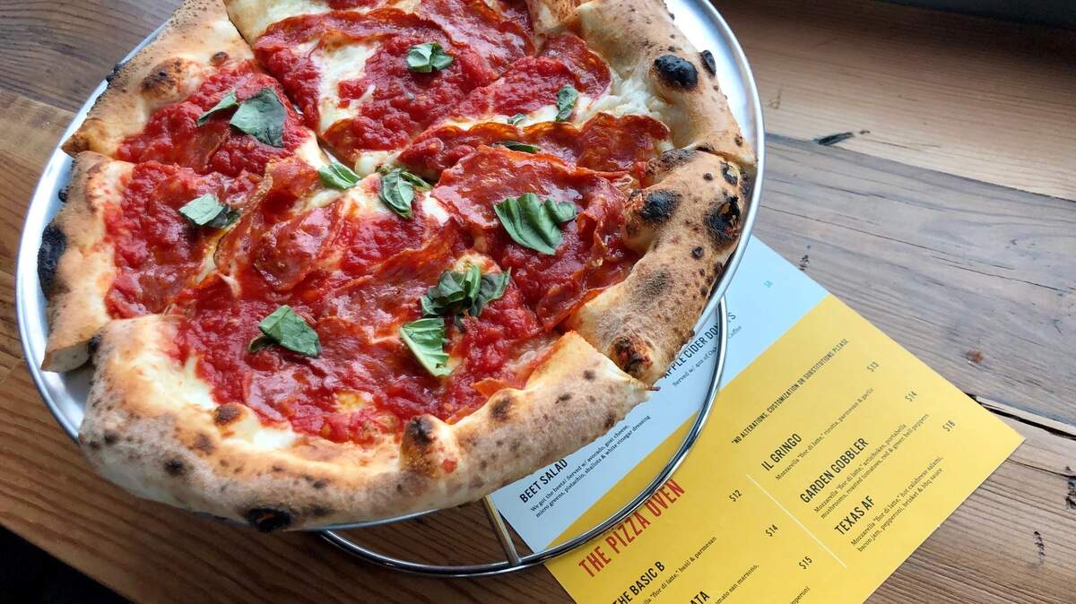 A spicy soppressata-tomato-basil pizza at Deep Ellum Brewing Co. in Fort Worth.