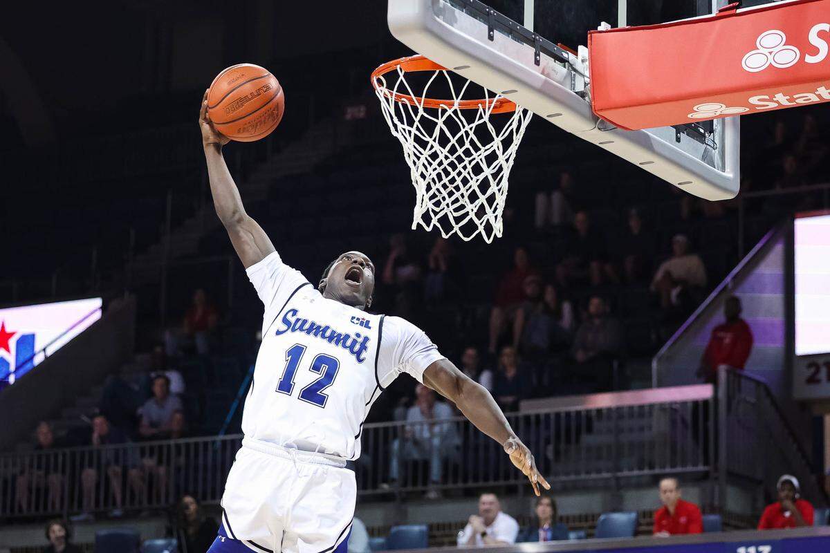 Mansfield Summit guard Josh Serunjoji leaps in the air to attempt a dunk on a fast break during a Class 5A Division II state semifinal against Lucas Lovejoy on Tuesday at Moody Coliseum in Dallas.
