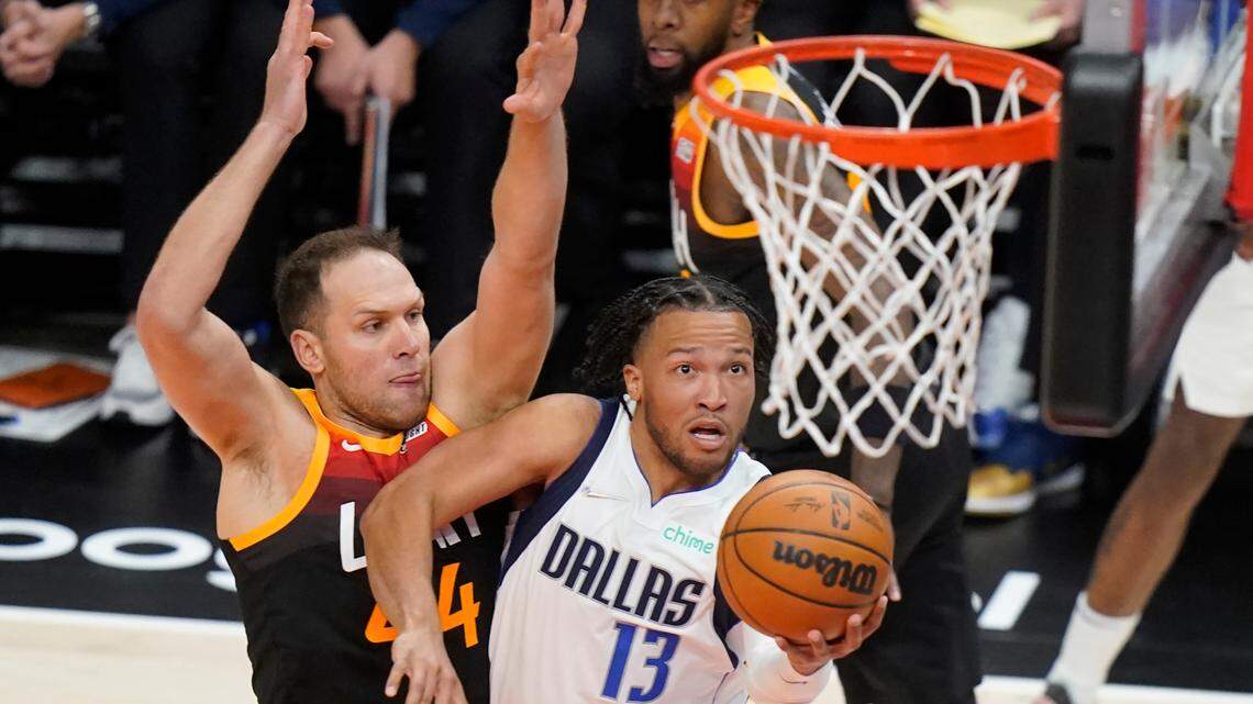 Dallas Mavericks guard Jalen Brunson (13) drives to the basket as Utah Jazz forward Bojan Bogdanovic, left, defends in the first half of Game 3 Thursday night in Salt Lake City. Brunson finished with 31 points in the Mavericks’ 126-118 victory.
