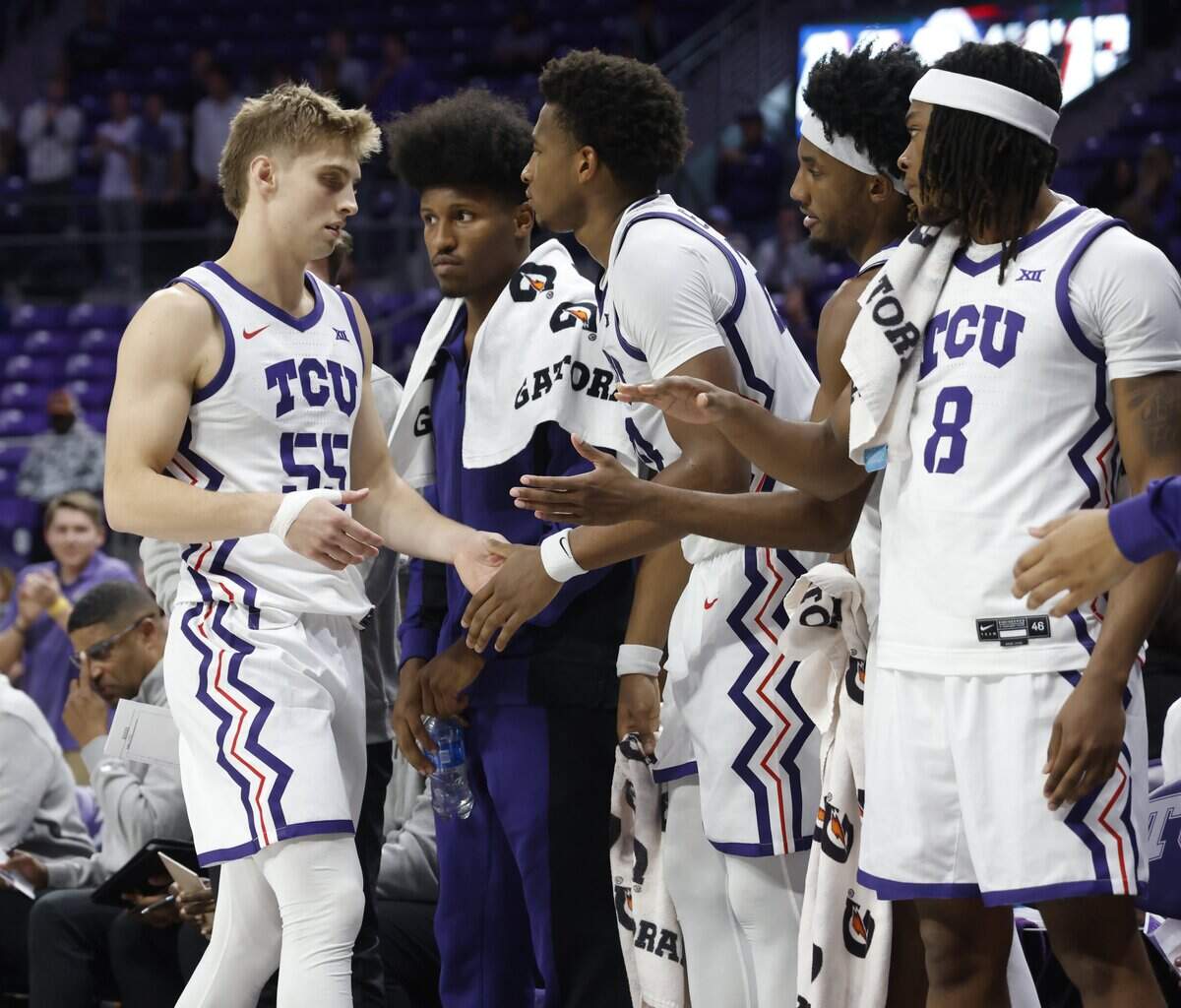 TCU guard Tanner Toolson (55) returns to the bench during the second half of a NCAA basketball game between New Orleans University and TCU at Schollmaier Arena in Fort Worth, Texas, Monday Nov. 03, 2025. The Horned Frogs dropped their home opener 78-74 to the Privateers.