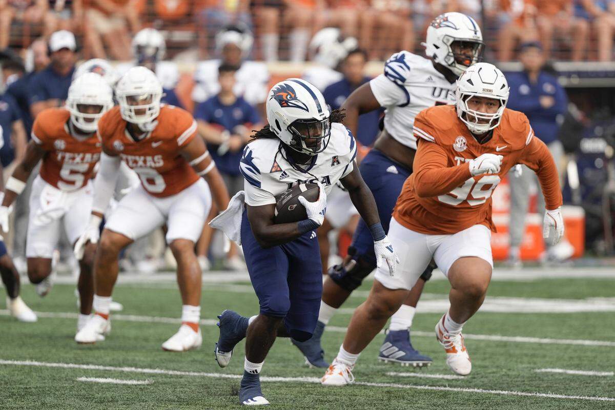 Sep 14, 2024; Austin, Texas, USA; Texas-San Antonio running back Kevorian Barnes (4) runs for yardage during the first half against Texas Longhorns at Darrell K Royal-Texas Memorial Stadium. Mandatory Credit: Scott Wachter-Imagn Images