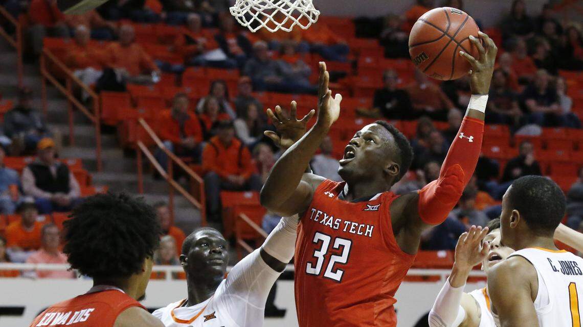 Texas Tech center Norense Odiase shoots in front of Oklahoma State forward Yor Anei in the second half Wednesday in Stillwater, Okla.