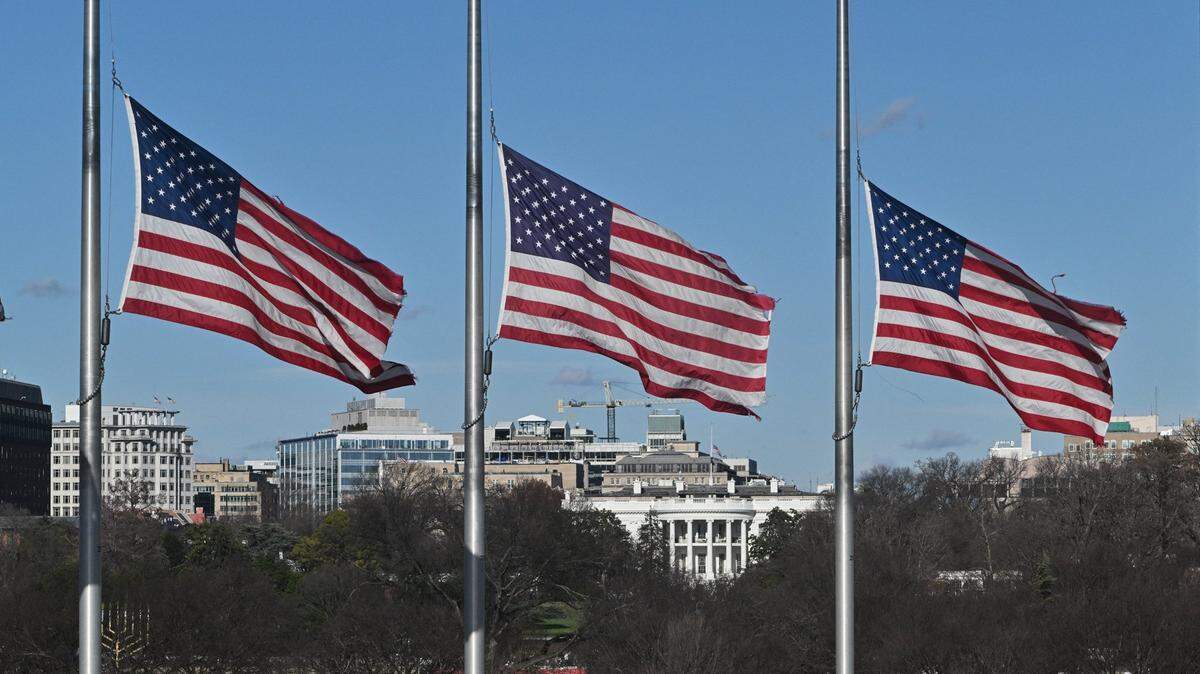 U.S. flags fly at half-staff on the National Mall near the White House in honor of former president Jimmy Carter, in Washington, D.C., on Dec. 30, 2024.