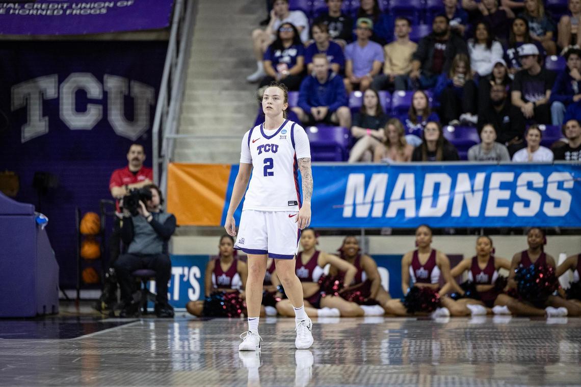 TCU guard Madison Conner (2) stands on defense between the TCU sign and March Madness sign in the second half of the first round of the Women’s NCAA Championships Tournament game between TCU and Fairleigh Dickinson at Schollmaier Arena in Fort Worth on Friday, March 21, 2025.