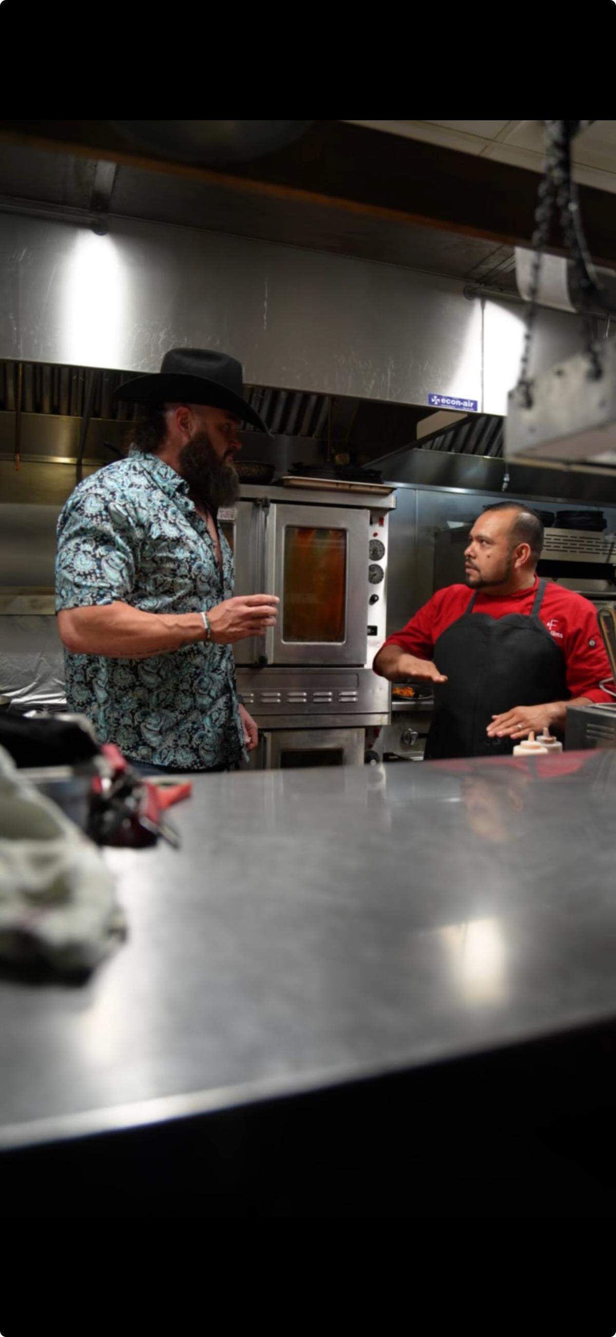 Braun Strowman and chef Jorge Olvera at the taping of “Everything on the Menu” at Wishbone & Flynt.