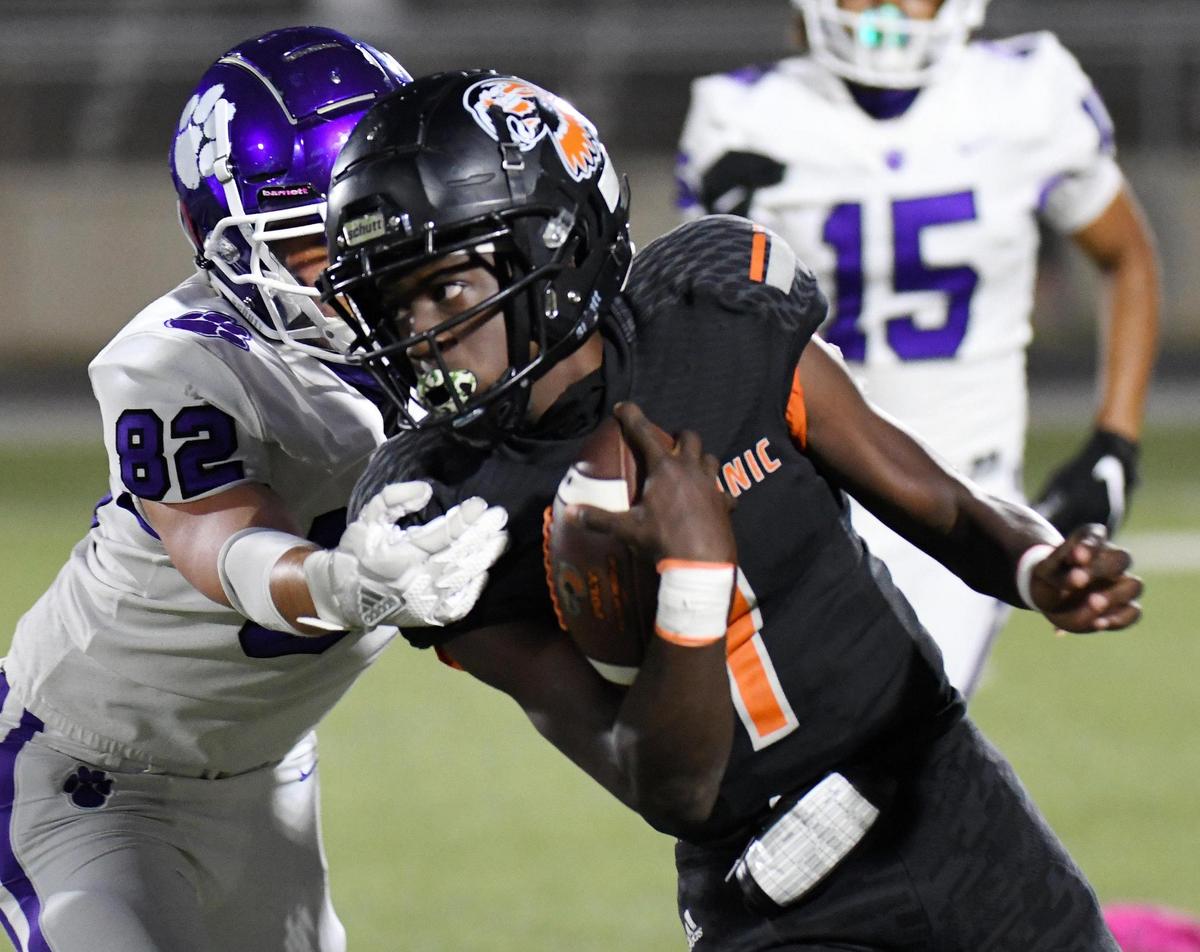 Paschal’s Alexavier Cardenas, left grabs Polytechnic quarterback Quincy Carter as he runs up the sideline for positiive yards in the first quarter of their football game Thursday, October 8, 2020 at Clark Stadium in Fort Worth, Texas. Special/Bob Haynes
