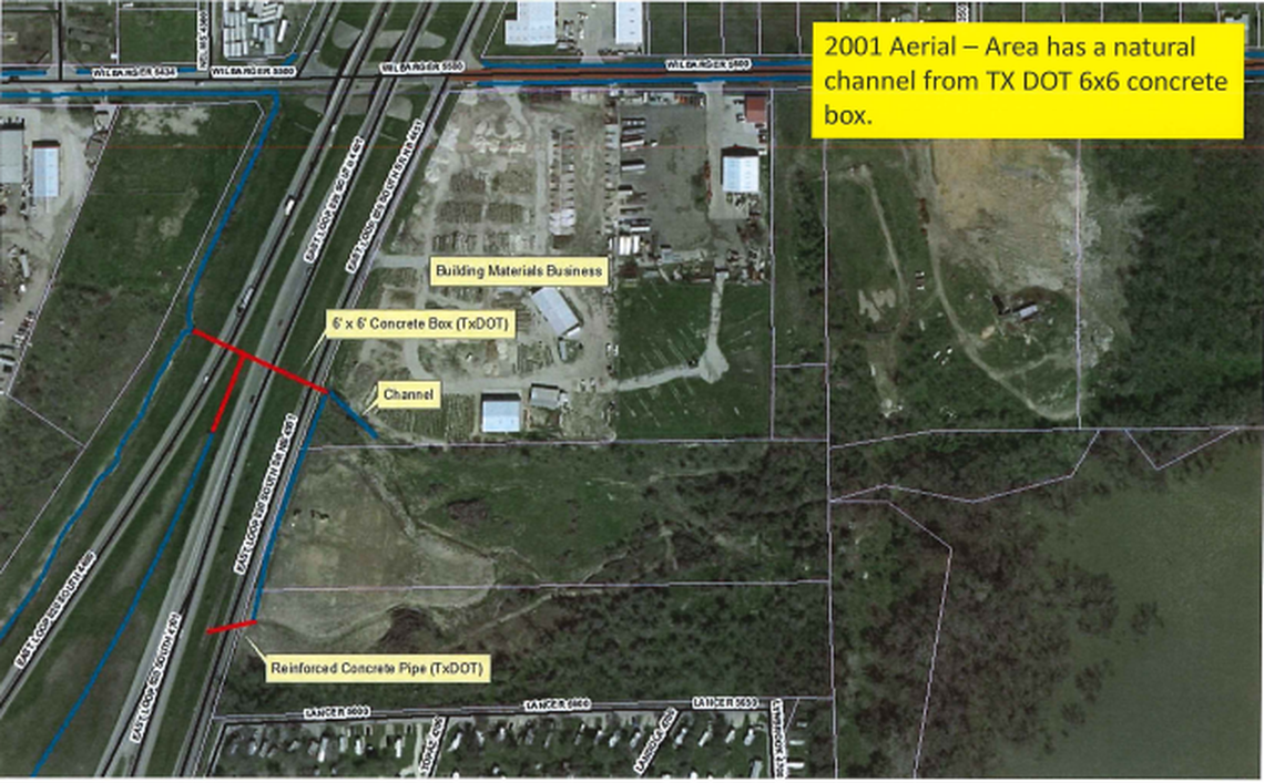 2001 aerial image of Lawhon Inc. property off Loop 820 South prior to drainage pipe being built. A natural channel of water ran from the frontage road into the property, draining into Lake Arlington.