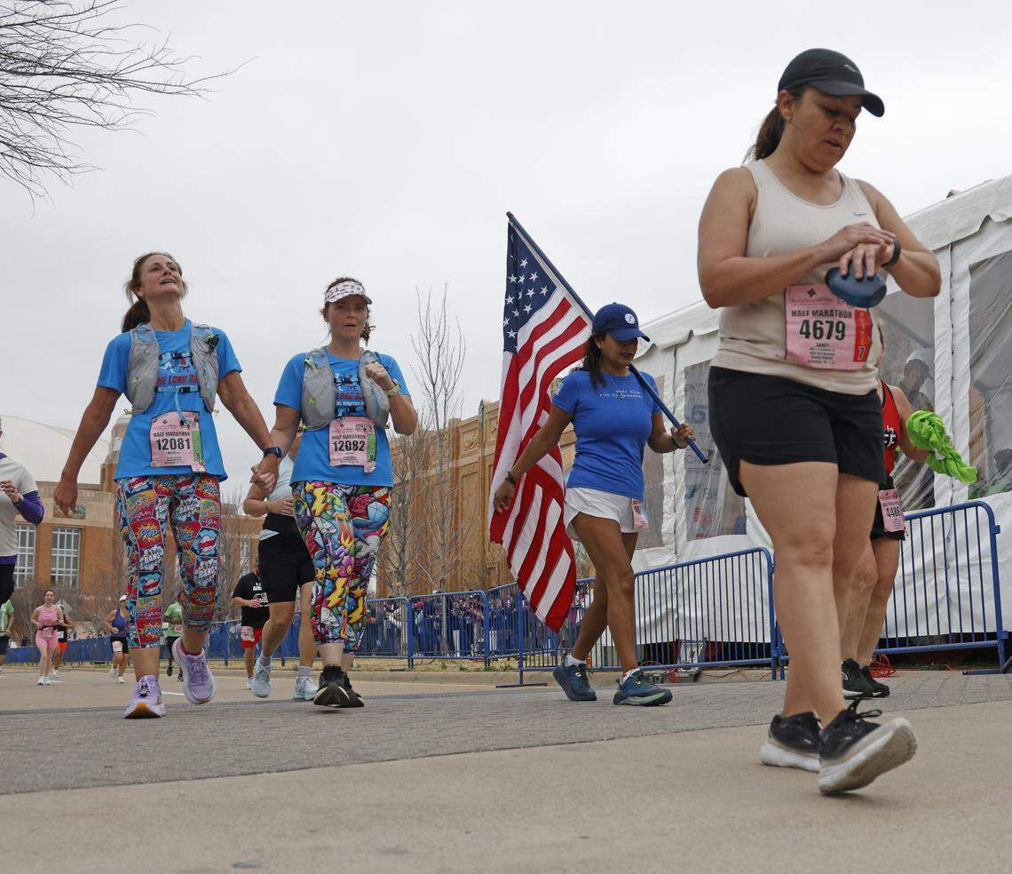 Grace Parker crosses the finish line during the 48th running of the Cowtown Marathon at the Will Rogers Memorial Center in Fort Worth, Texas, Sunday, Mar. 01, 2026.