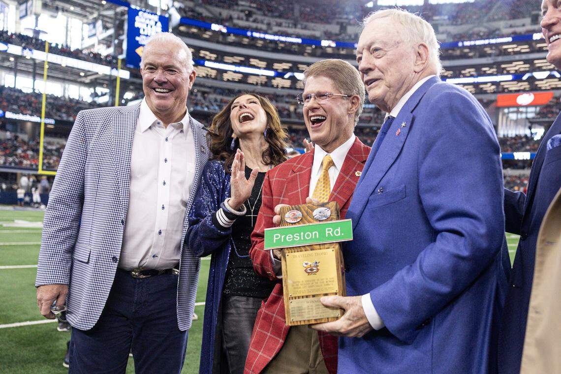 Cowboys owner Jerry Jones and the Jones family take a photo with Chiefs owner Clark Hunt prior to the first half of an NFL game between the Dallas Cowboys and the Kansas City Chiefs at AT&T Stadium in Arlington on Thursday, Nov. 27, 2025.
