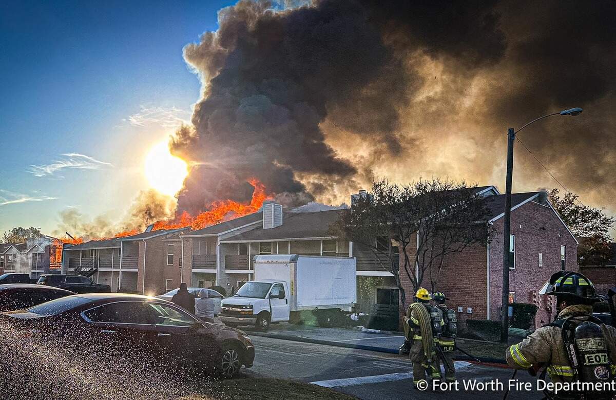 Fort Worth firefighters respond to a fire at 13716 Gazebo Lane on Wednesday, Dec. 9, 2025. An official said almost 50 residents were displaced and one firefighter suffered burn injuries.