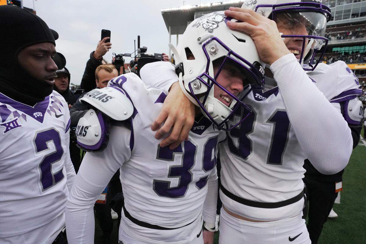 TCU place kicker Griffin Kell (39) celebrates with Jordy Sandy (31) and other teammates after hitting a field goal in the final seconds of an NCAA college football game against Bayor in Waco on Saturday.