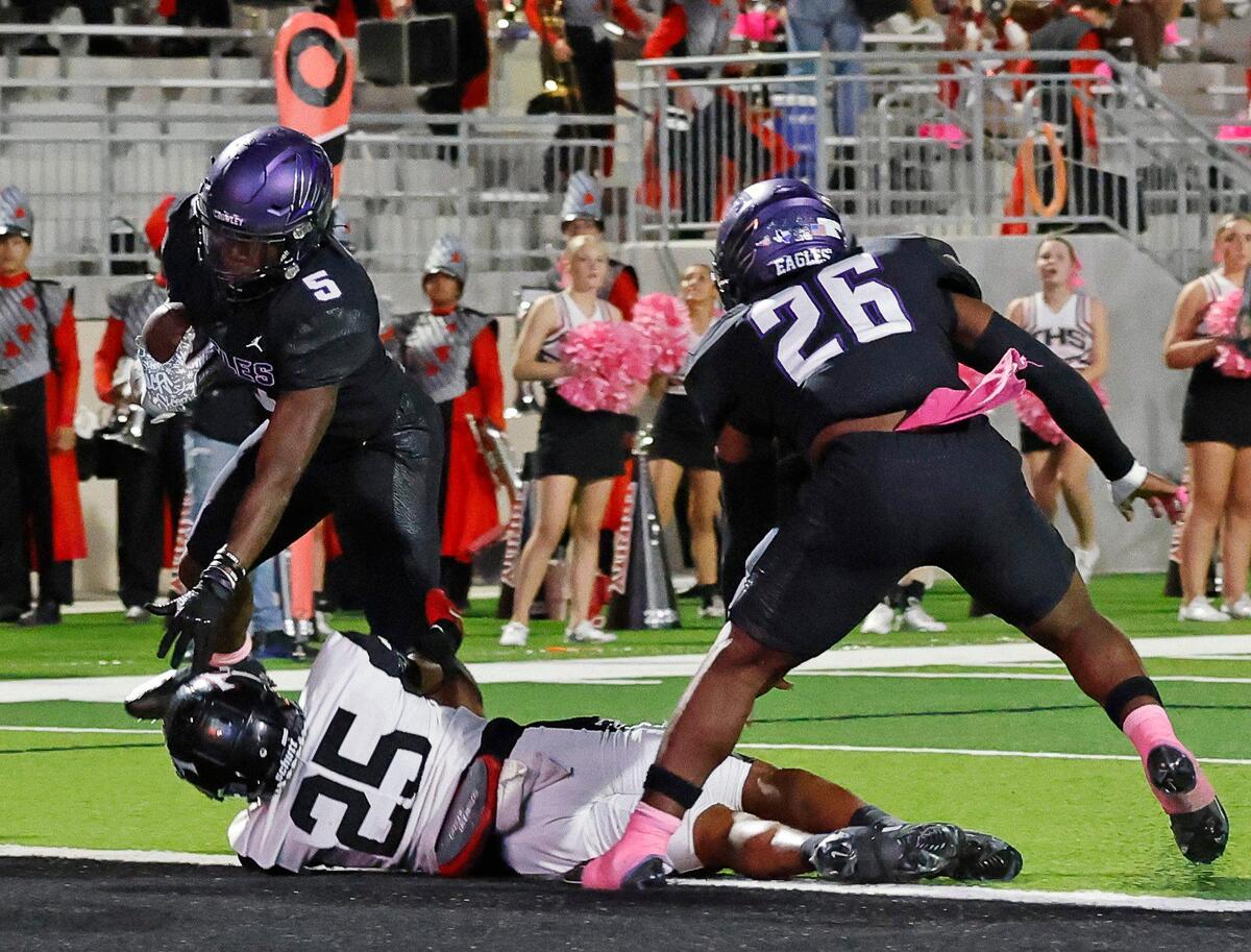 Crowley running back Caleb Pope (5) takes it one yard for the touchdown in the first half of a UIL high school football game at Crowley ISD Multi-Purpose Stadium in Crowley, Texas, Friday, Oct. 20, 2023.