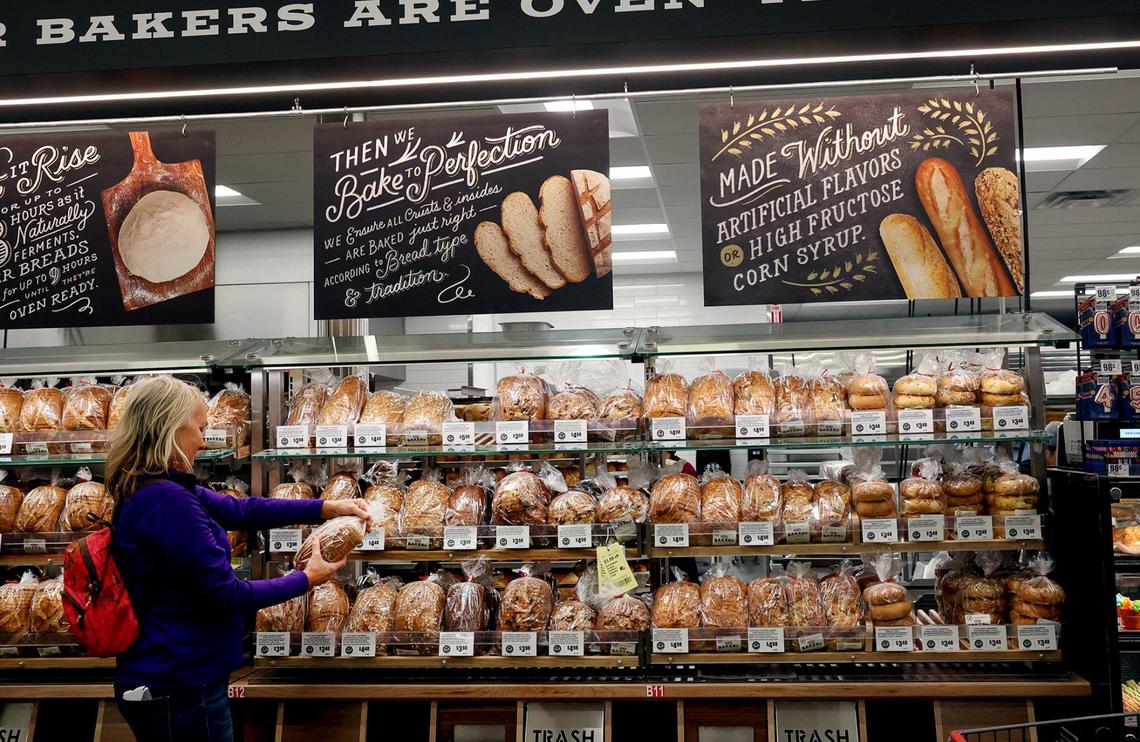 Fort Worth resident Linda Miller looks at the freshly baked bread at the Fort Worth Alliance H-E-B on Wednesday. Miller arrived at the H-E-B on Tuesday at 7:30 p.m. and slept overnight in a tent to be one of the first customers to enter the store. “It’s always been on my bucket list,” said Miller. She was interested in bread selection and choice a German rye in honor of her family’s German heritage.