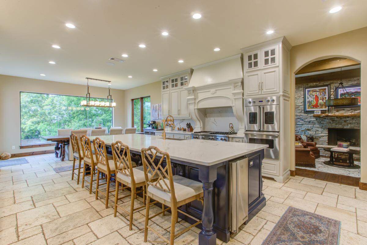 9930 Boat Club Road is lit up with natural light through it’s wall long windows that look out at Eagle Mountain Lake.