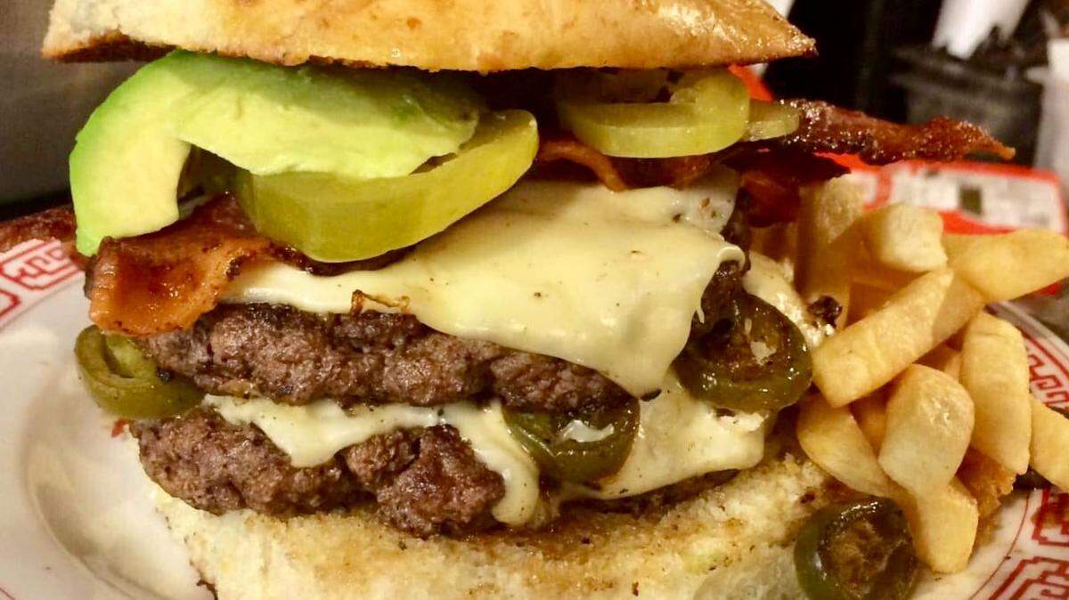 A burger at Salsa Joe’s Tex-Mex Smokehouse, soon to open on West Park Row Drive.