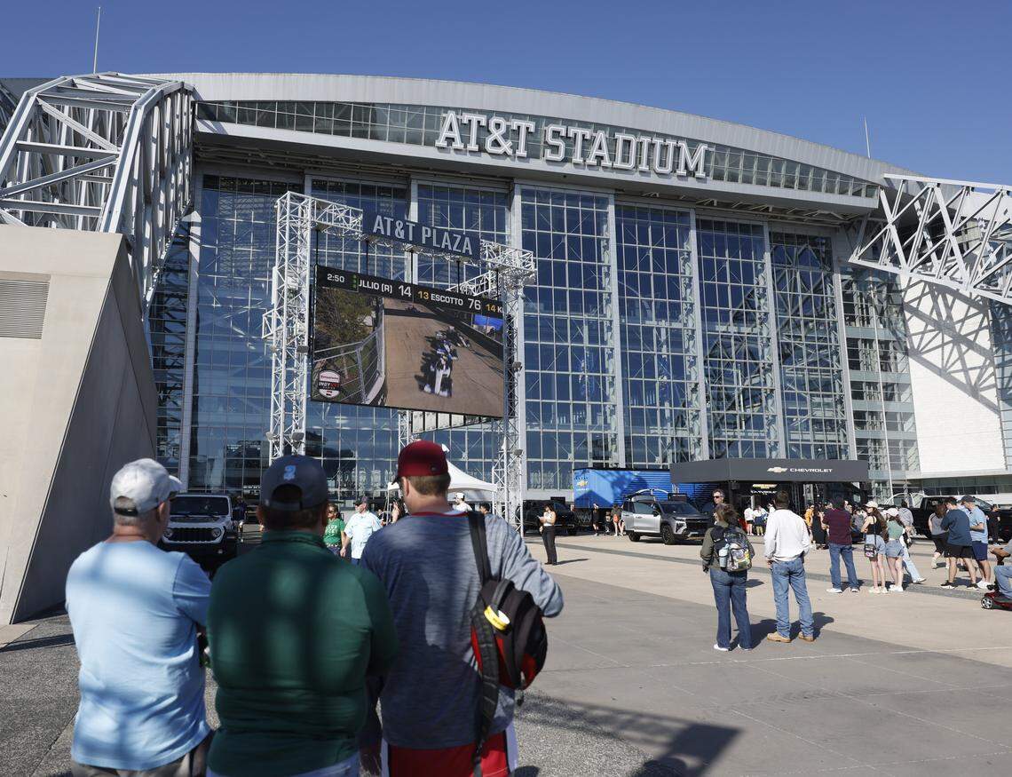 Fans watch the race on several jumbo trans placed around ATT Stadium, Globe Life Field and the race track during the inaugural Java House Grand Prix of Arlington in Arlington, Texas, Sunday, March, 15, 2026.