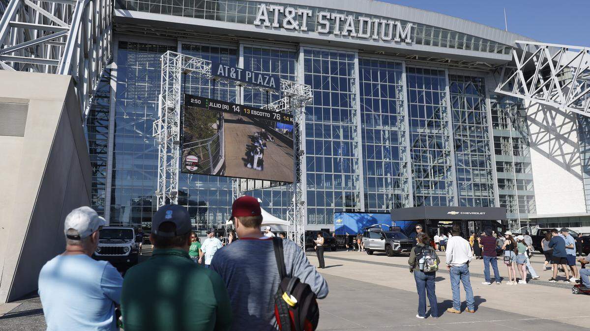 Fans watch the race on several jumbo trans placed around ATT Stadium, Globe Life Field and the race track during the inaugural Java House Grand Prix of Arlington in Arlington, Texas, Sunday, March, 15, 2026.