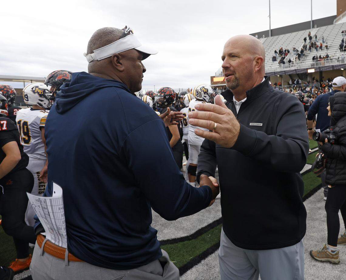 Fort Worth Arlington Heights head coach Curtis James congratulates Aledo head coach Robby Jones after the UIL Class 5A Division I Regional on Friday Nov. 28, 2025 at Crowley ISD Multi-Purpose Stadium in Fort Worth, Texas.