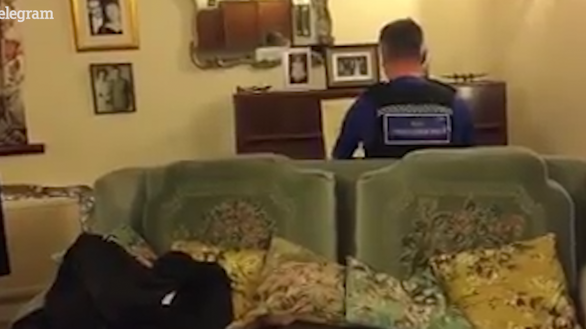 A police officer in Mansfield, England surprises an elderly man with a piano performance during a check-in after the man's home was broken into in January.