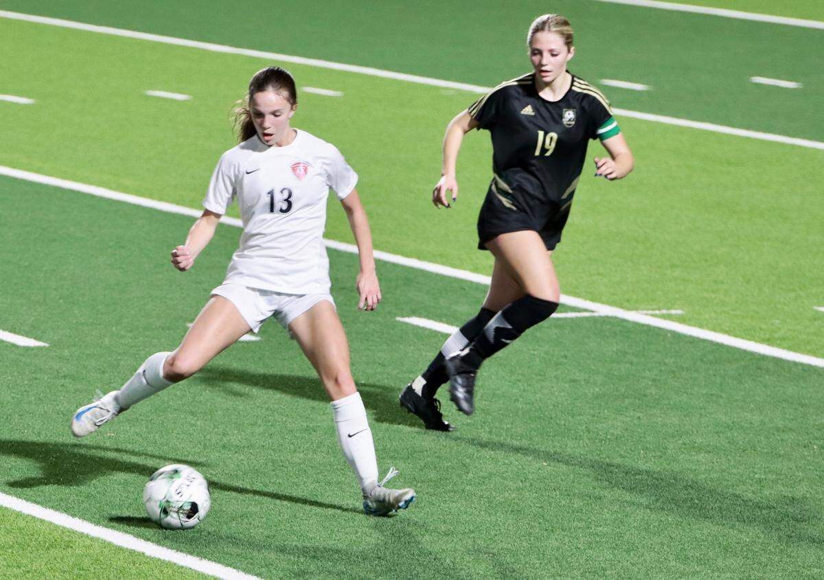 Sophomore forward Ashlyn Bringedahl passes in a district game against Birdville at Birdville High School in North Richland Hills, Texas, on Friday, March 7, 2025.