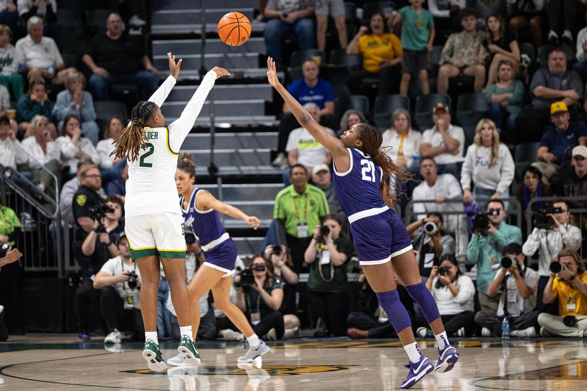 TCU guard Agnes Emma-Nnopu (21) contests the three-point jump shot by Baylor guard Yaya Felder (2) in the final seconds of the second half of an NCAA game between TCU and Baylor at Foster Pavilion in Waco on Sunday, March 2, 2025.